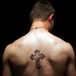 Cross tattoo on back